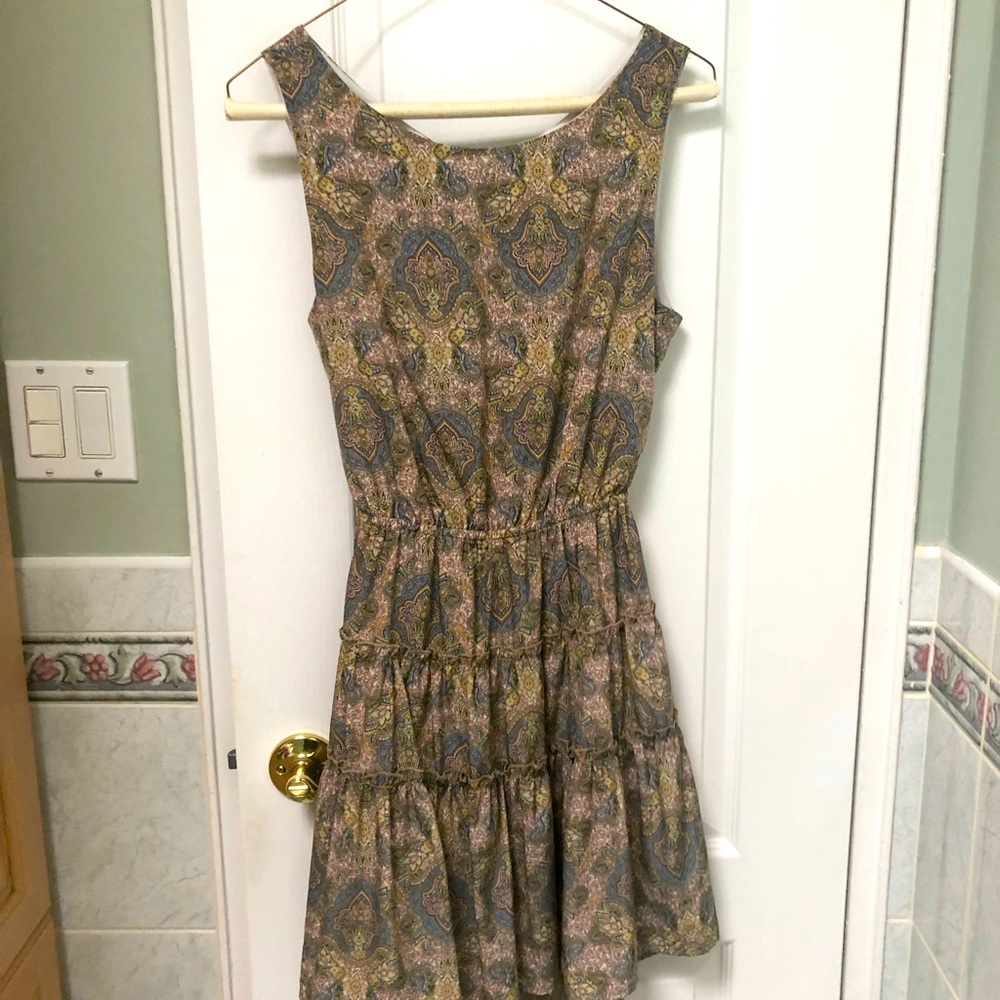 Tiered sleeveless summer dress with cutout in back. New condition
